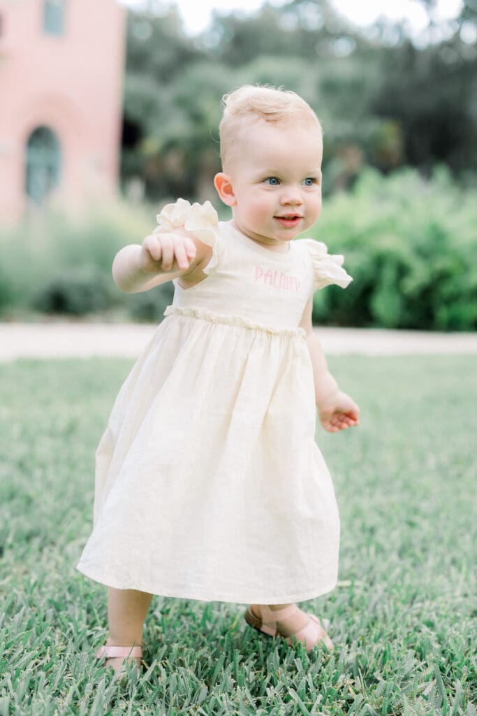 Toddler walking in Sims Park for Tampa maternity session.