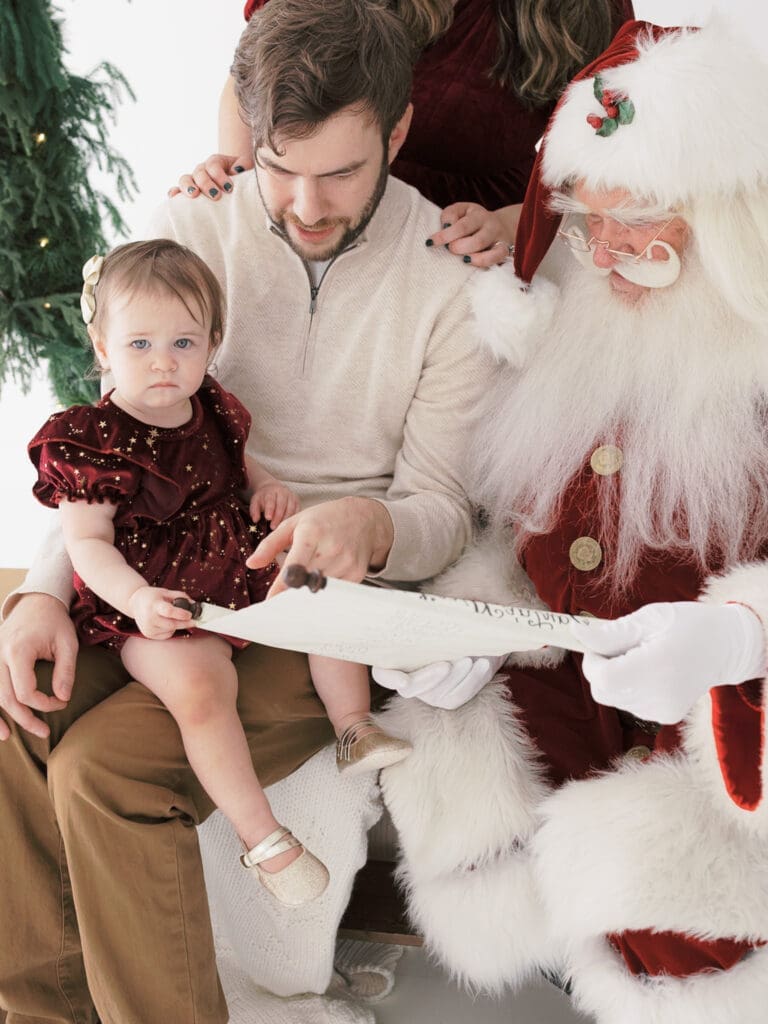 Photo of a baby with Santa for Tampa photographer, Tina Marie Studio.