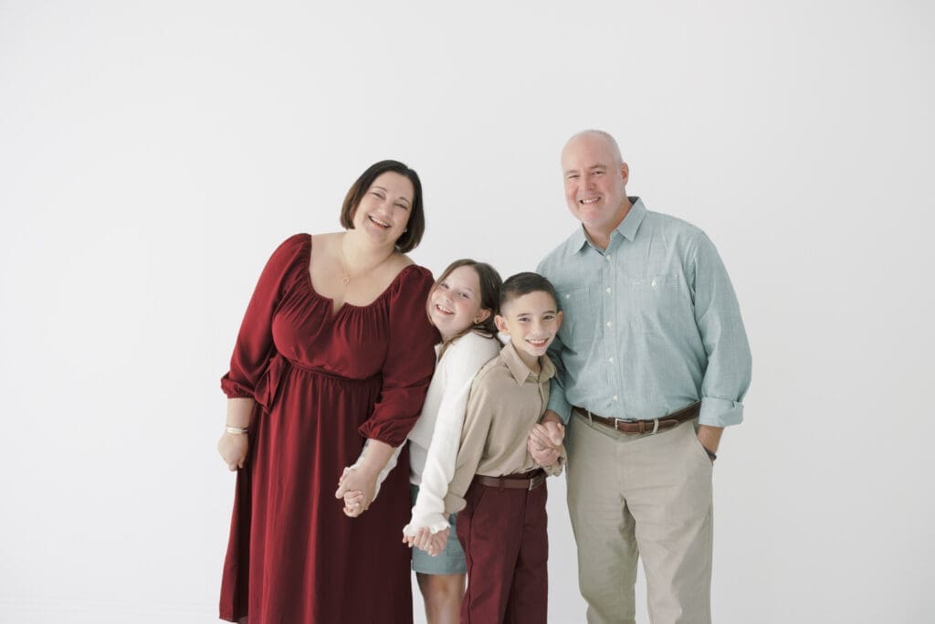 Family wearing coordinated Christmas Family Photo Outfits in Tampa.